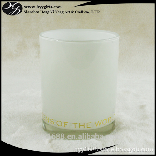 empty white glass votive candle holder with gold aluminum foil prints
